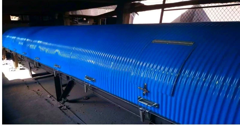 Conveyor dust cover installed on port conveyor line for dust and corrosion control Conveyor dust cover installed on port conveyor line for dust and corrosion control